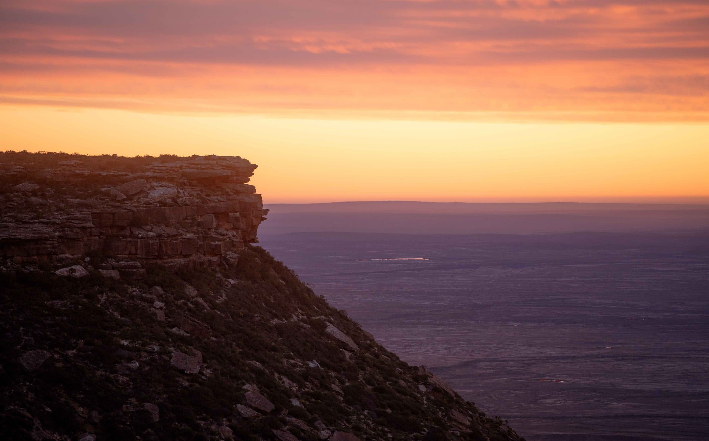 The sandstone krans at sunset, looking west over the Knersvlakte far below