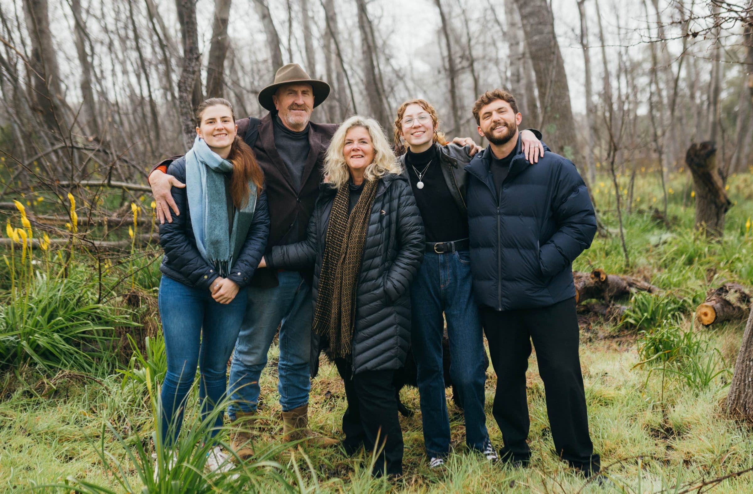 The Nel family among winter trees and yellow flowers: Enya, Japie, Frances, Angelique and Alex Nel, left to right