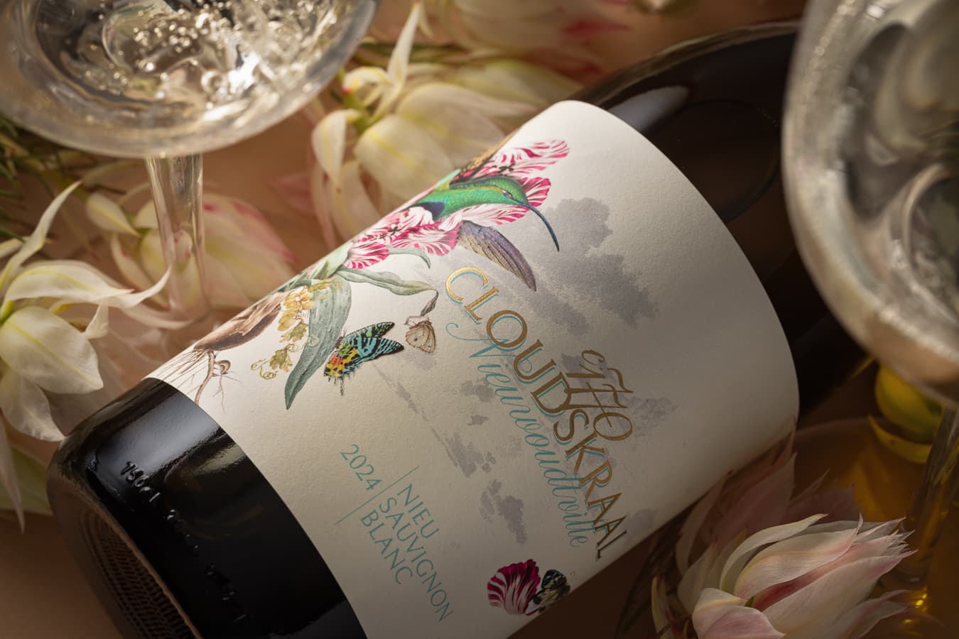 The 2024 label close up: sunbird, butterflies and bulbs, with the Nieuwoudtville script