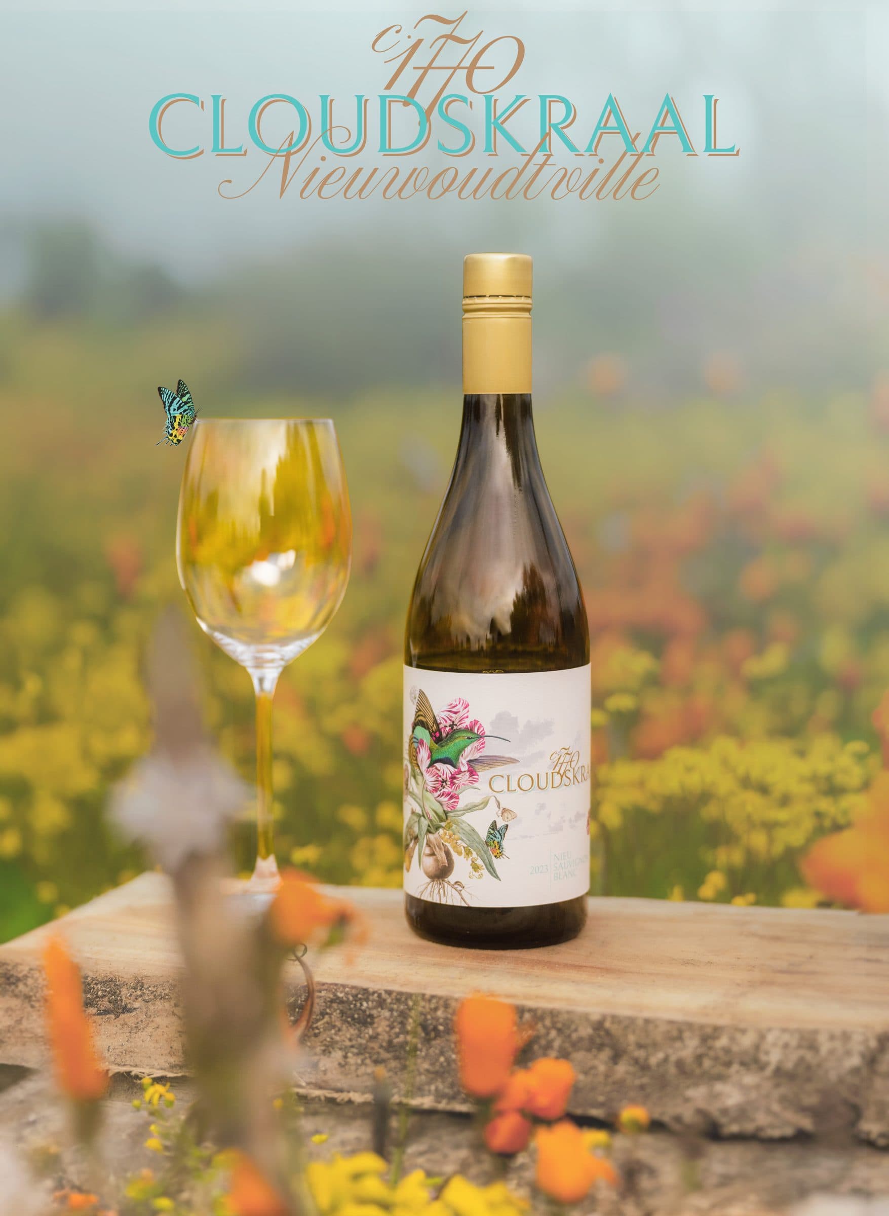 A bottle and glass of the 2023 Nieu Sauvignon Blanc on a rock among spring wildflowers, beneath the Cloudskraal wordmark